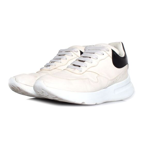 Alexander McQueen cream colored trainers